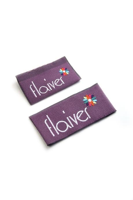 Woven label design for Flaiver fashions - fashion product branding by Paul Cartwright Branding.