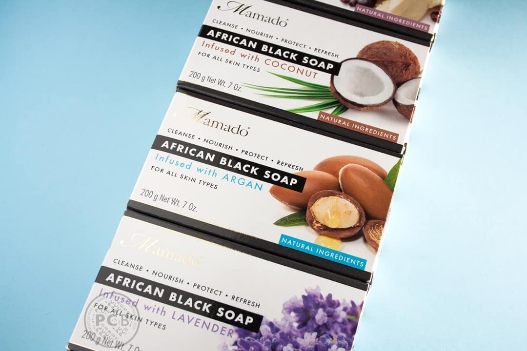 Close-up studio image of African black soap packaging