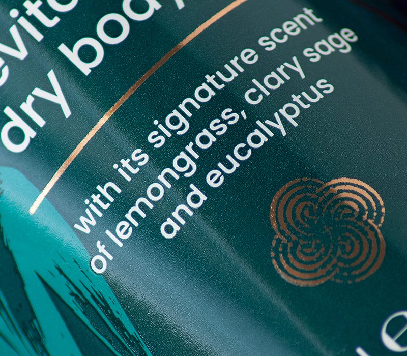 Close-up of Kaniz dry oil bottle label graphics.